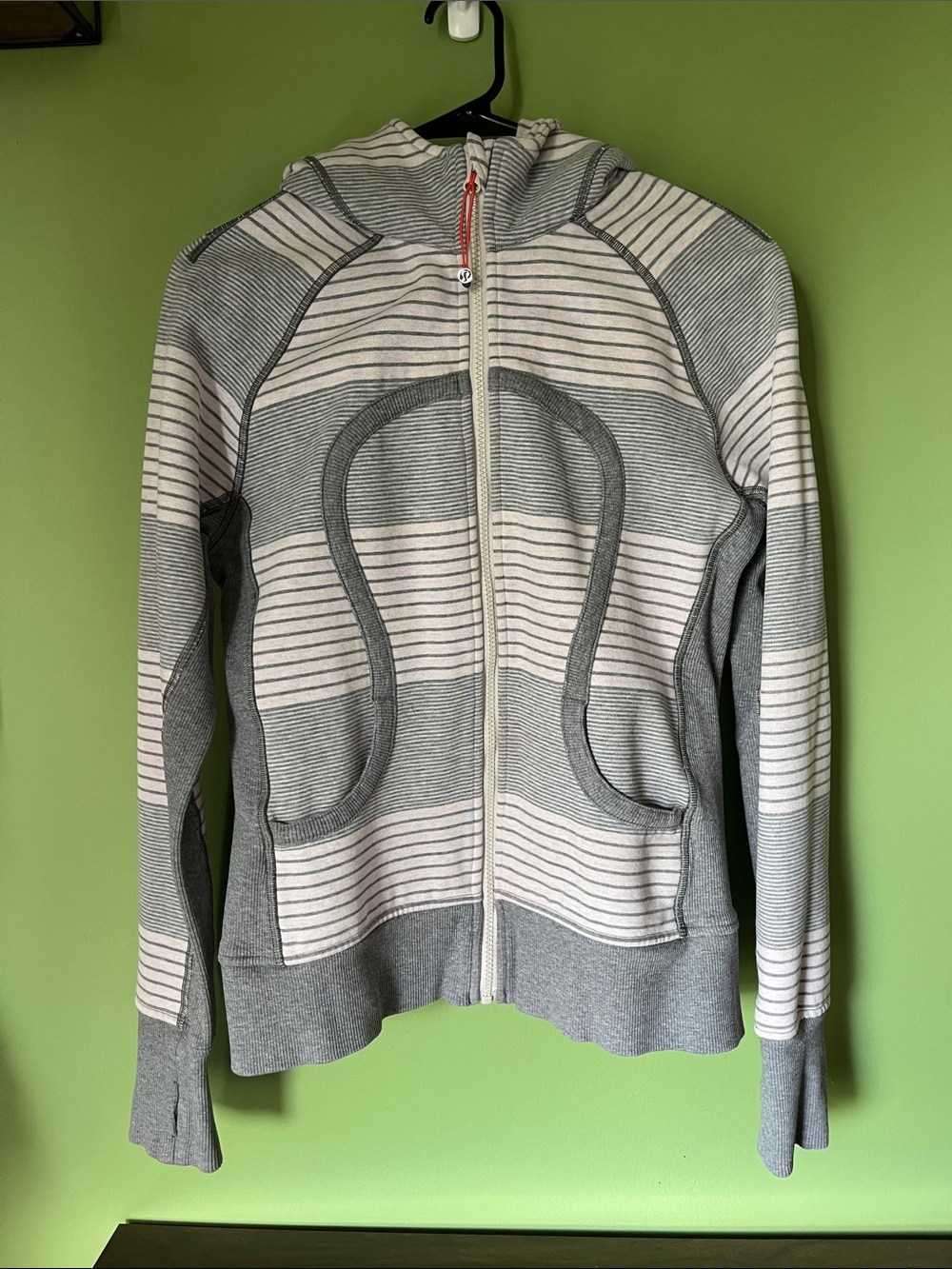 Lululemon Zip-Up Hoodie in Light Gray and white.